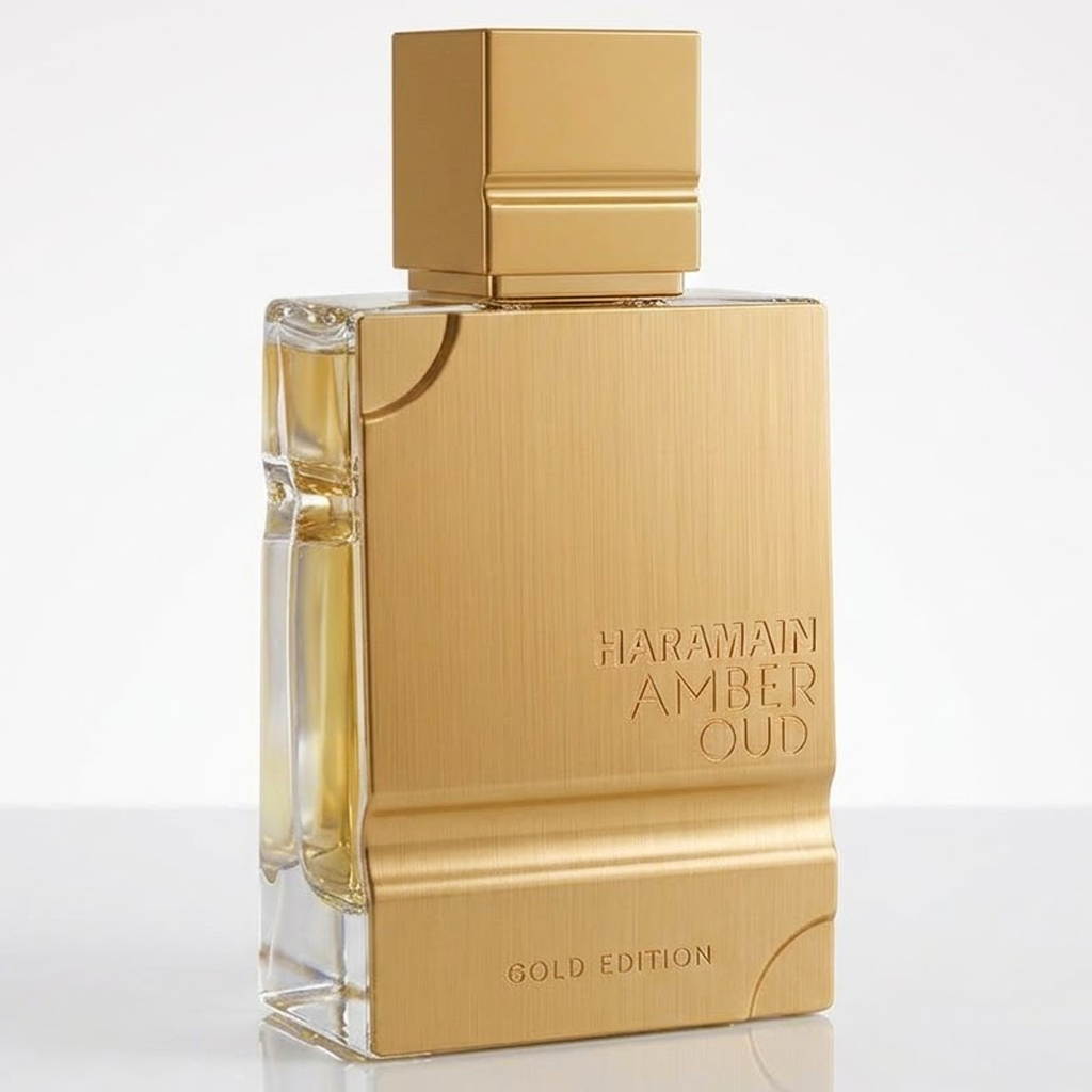 Haramain Amber Oud Gold Edition perfume bottle with a brushed gold metallic finish and clear glass sides, on a white background.